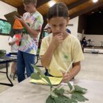 Two 4-H'ers concentrate on tree identification